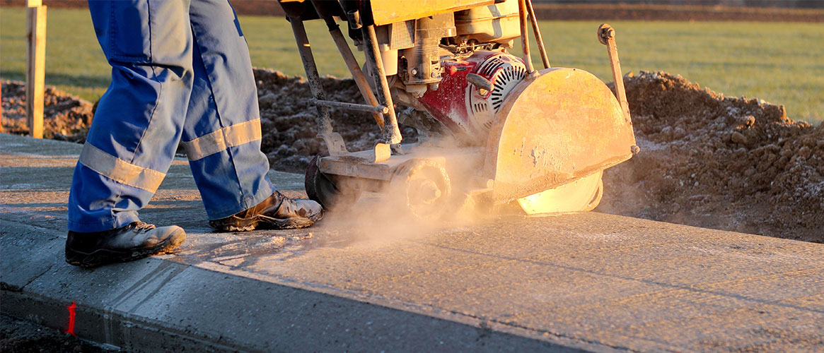 worker cutting cement