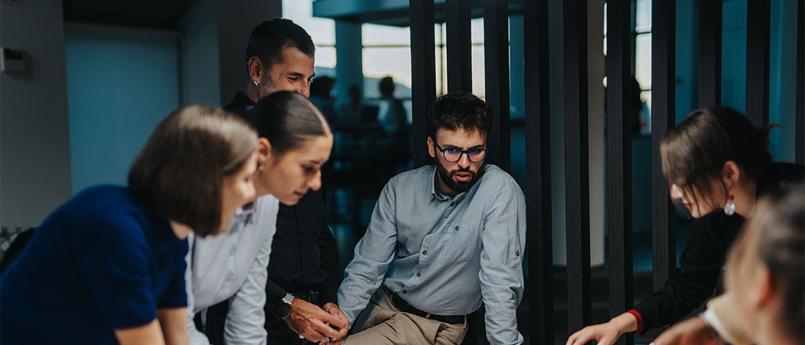 Coworkers engaged in emergency planning for their workplace