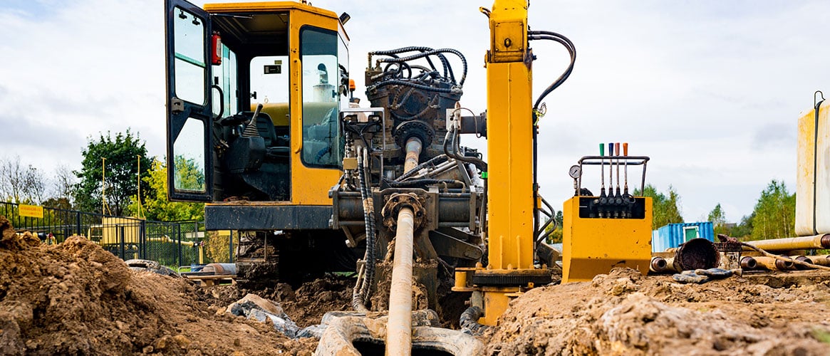 Horizontal directional drilling machine ready to pull cables through the underground tunnel it just dug.