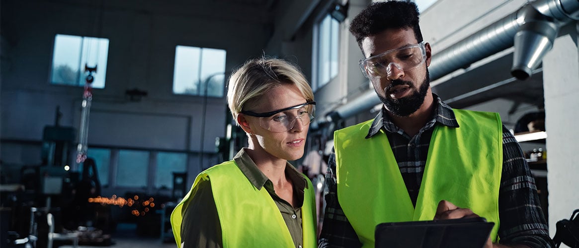 Coworkers discussing safety while at work