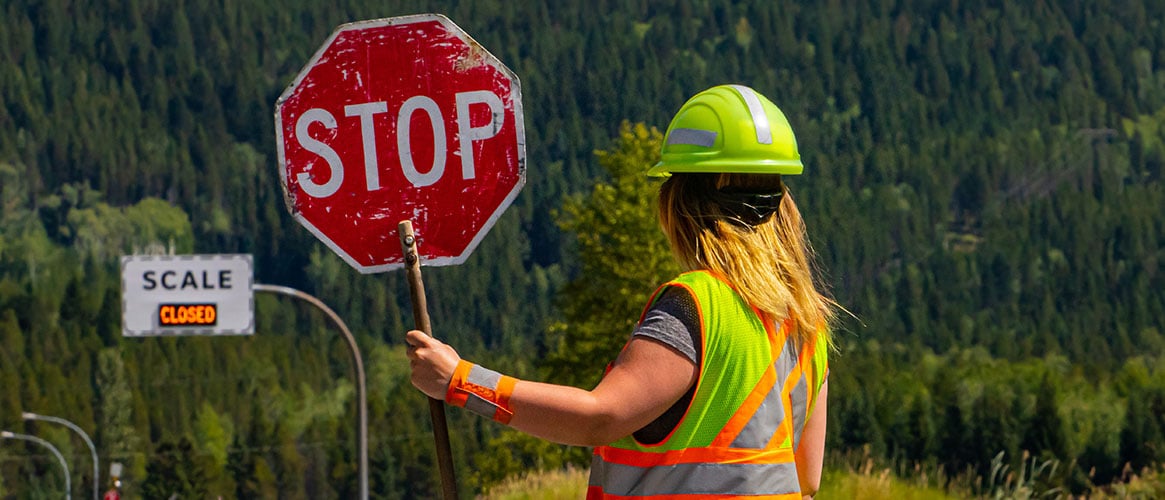 flagger with stop sign