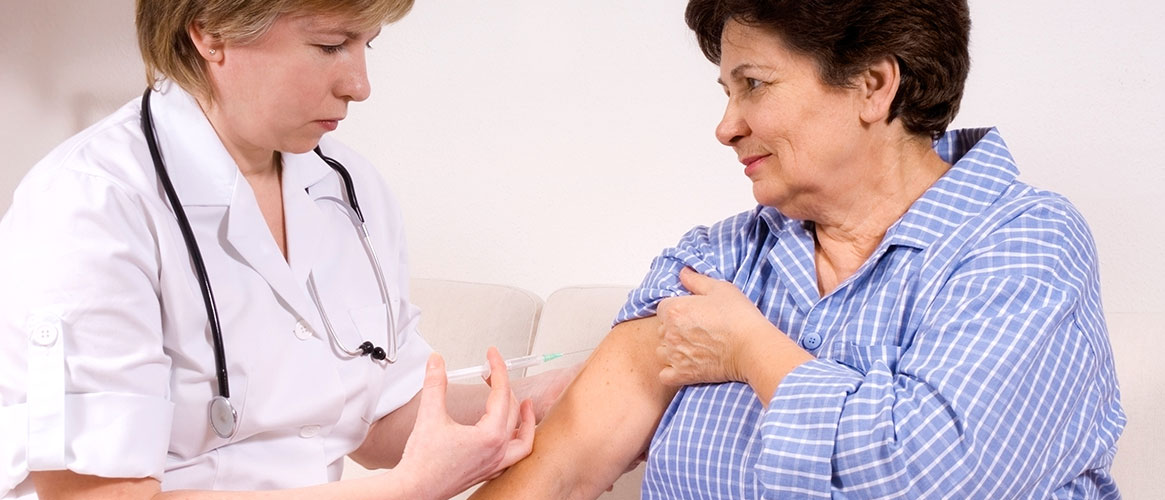 nurse giving flu shot