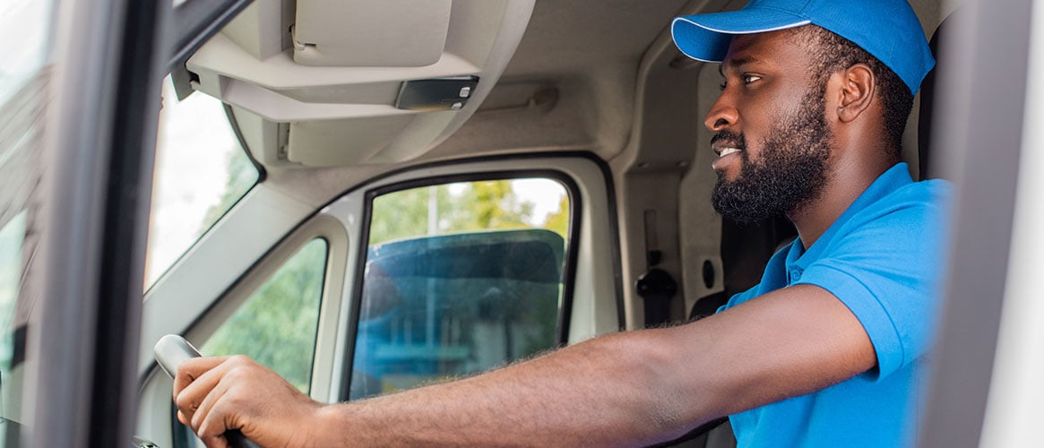 driver behind the wheel of a truck